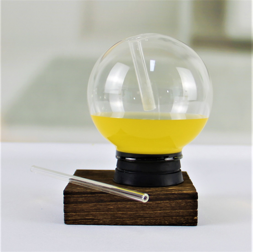 Modern glass spherical beverage cups with straws